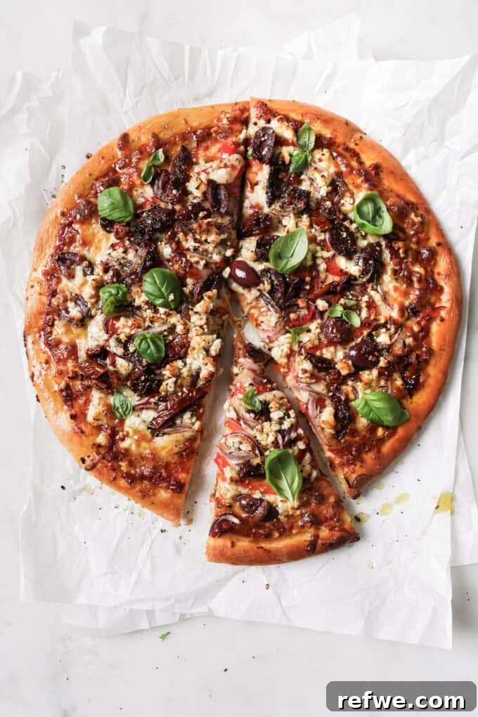 Sun-Kissed Mediterranean Pizza 9 mediterranean pizza with a slice cut out