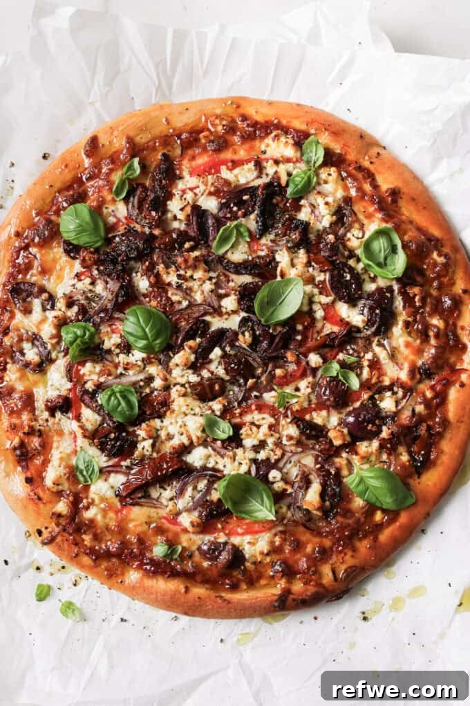 Sun-Kissed Mediterranean Pizza 10 mediterranean pizza topped with fresh basil leaves