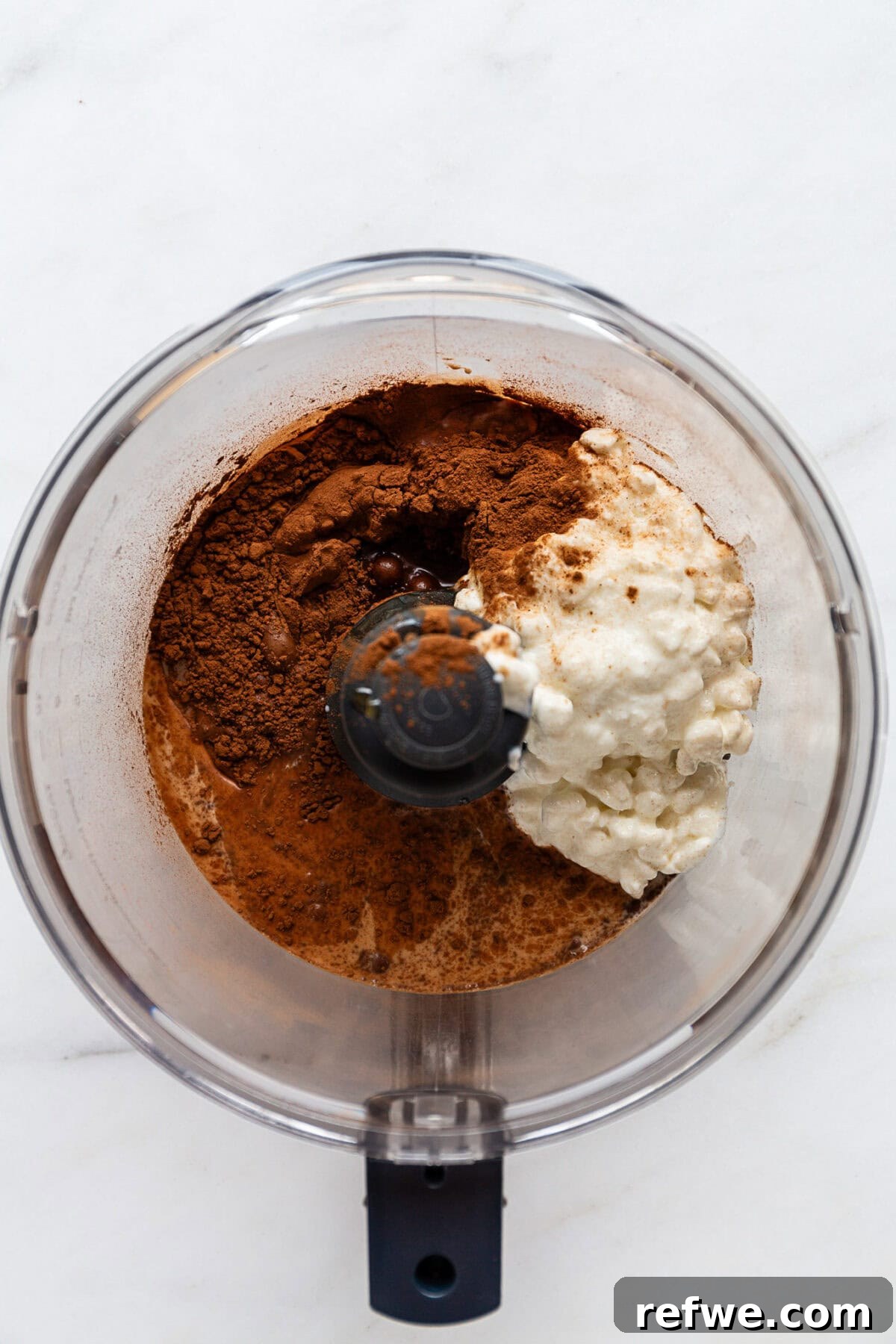 cottage cheese, coconut milk, cocoa, maple syrup and vanilla in a food processor.