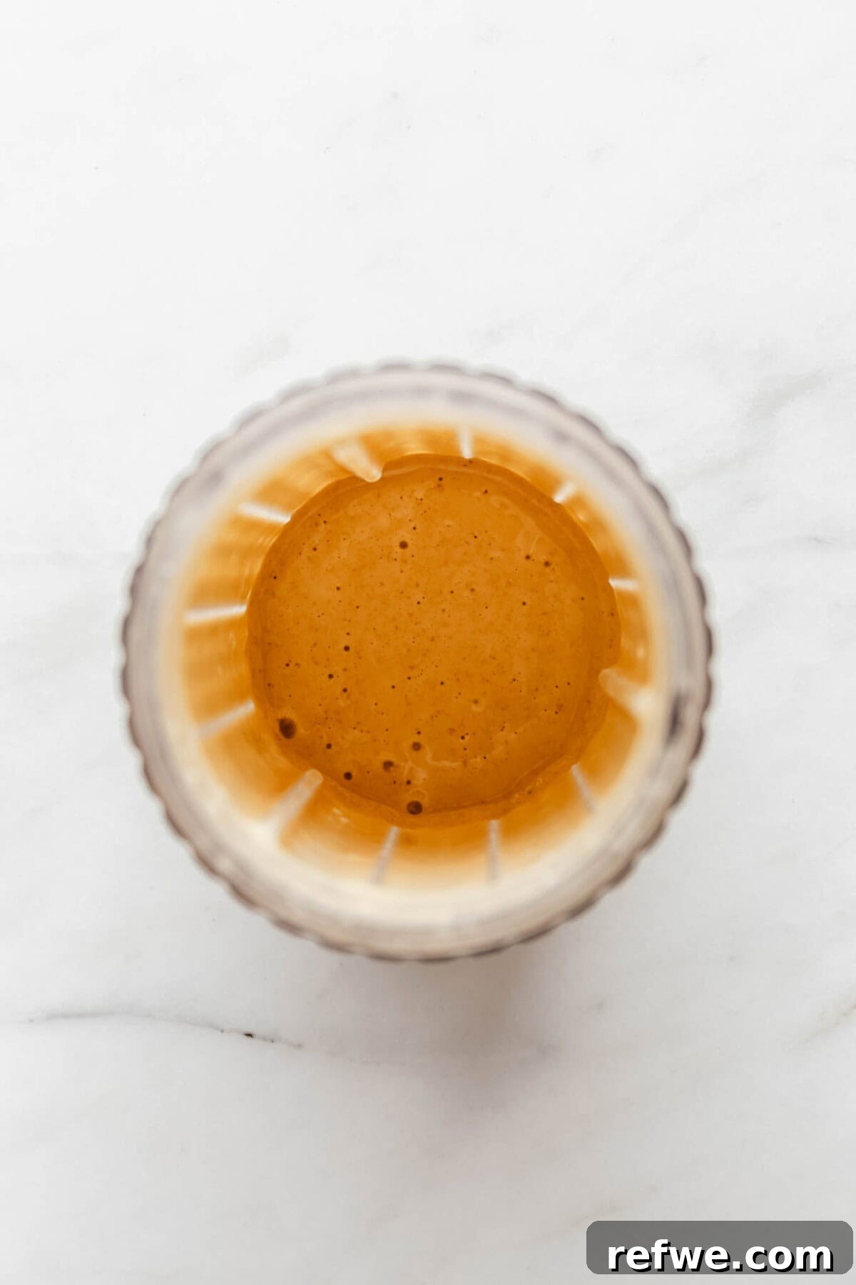 Peak Performance Pancake Bowl 5 The pancake bowl batter, now perfectly smooth and creamy, is shown inside a blender container after a thorough blending process.
