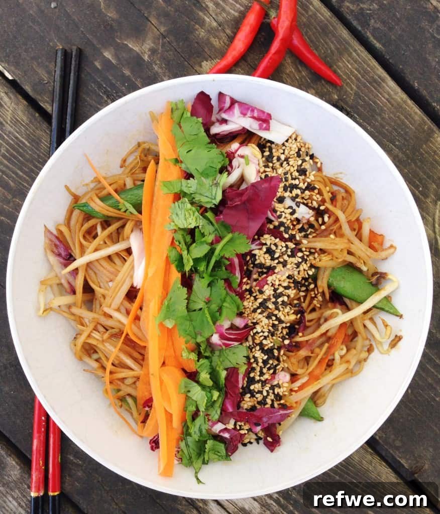 Delicious and Healthy Pad Thai with fresh vegetables and crushed peanuts