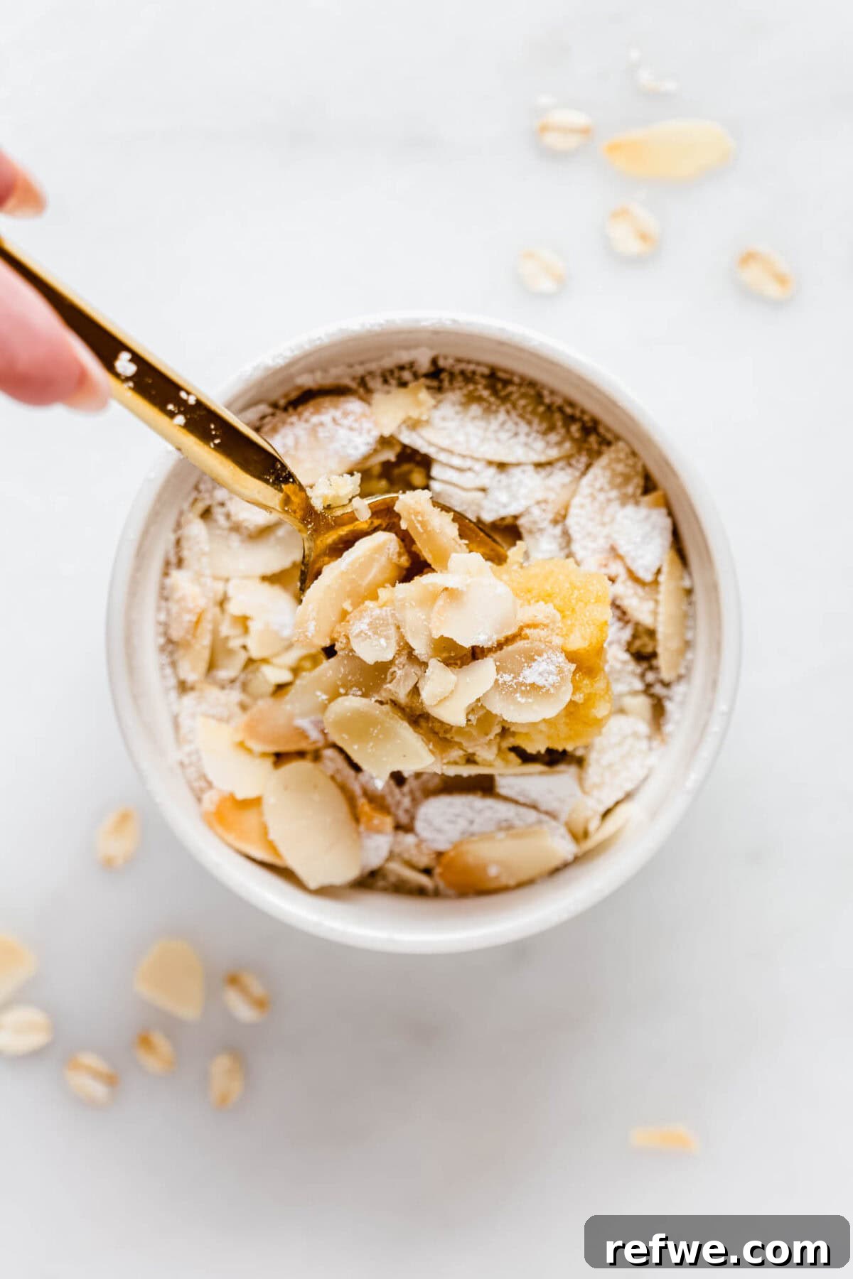 A beautifully baked ramekin of almond croissant oats, ready to be enjoyed.