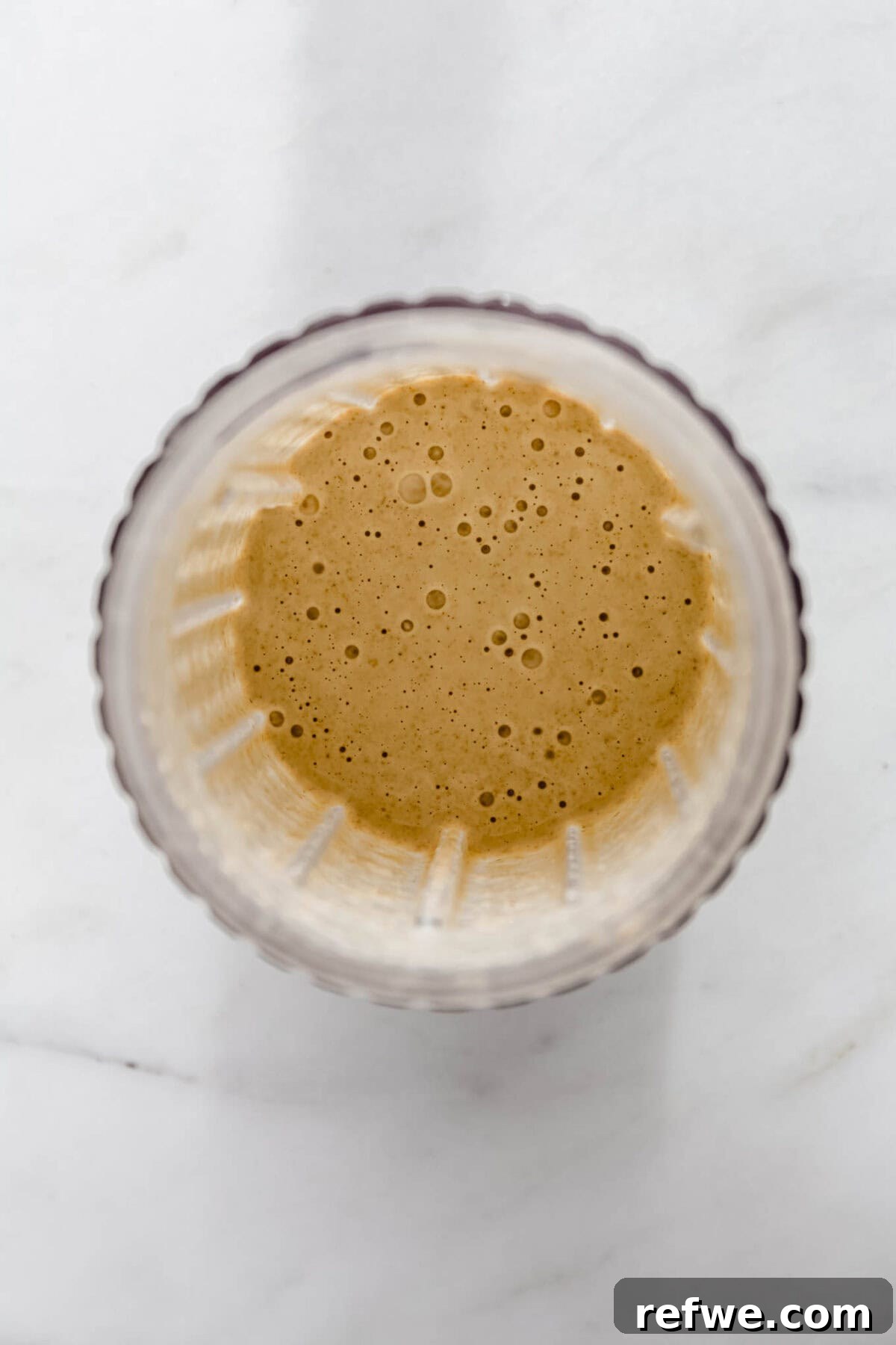 Blender with baked oats mixture blending until smooth.