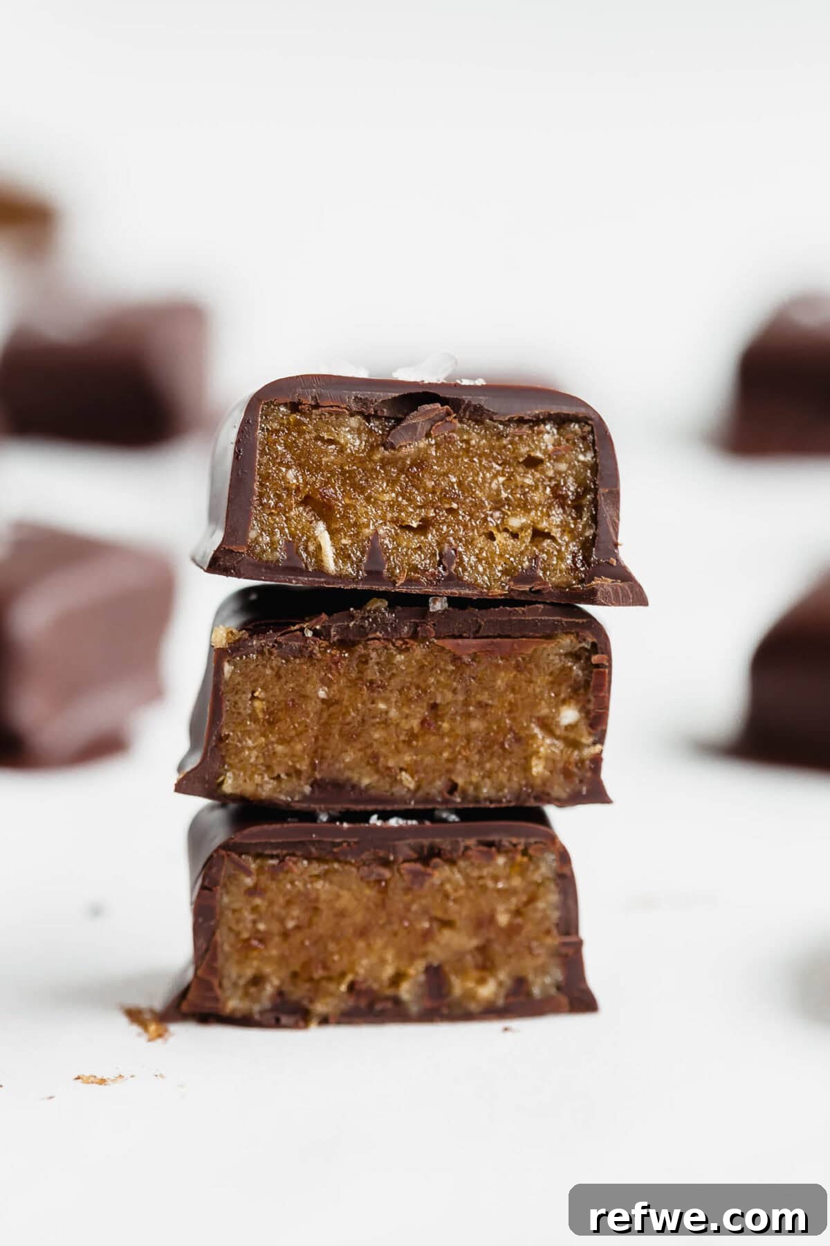 Date Caramel Chocolate Indulgence 11 Three date caramels stacked neatly on top of each other, ready to be enjoyed.