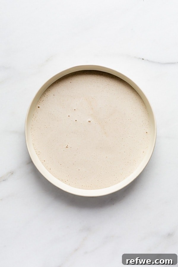 A bowl of creamy vegan French toast batter, ready for dipping.