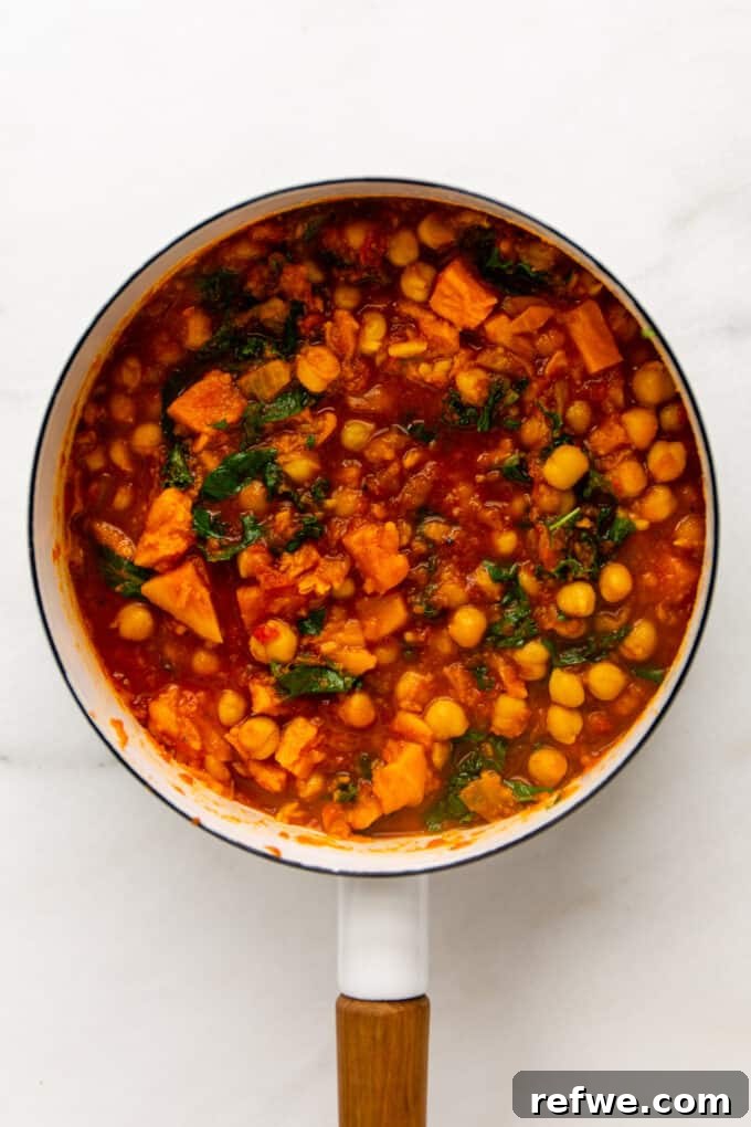 Fragrant Moroccan Chickpea Stew 8 A close-up of the rich, thick Moroccan chickpea stew in a white pot, ready to be served.