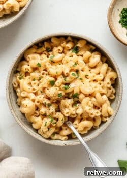A vibrant bowl of cottage cheese mac and cheese, perfect for a high-protein, quick meal.