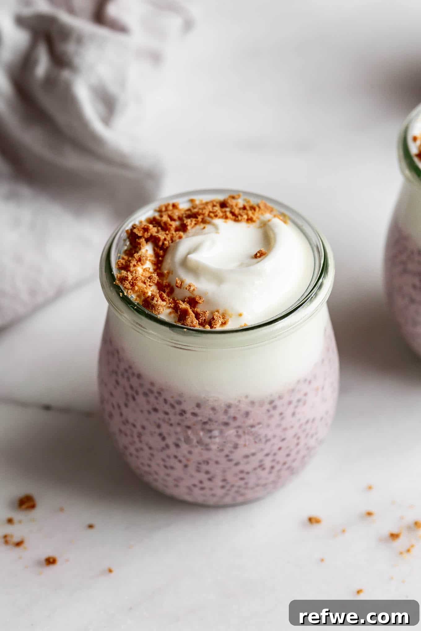 Supercharged Protein Chia Pudding 2 Protein chia pudding in a cup topped with graham cracker crumbs.
