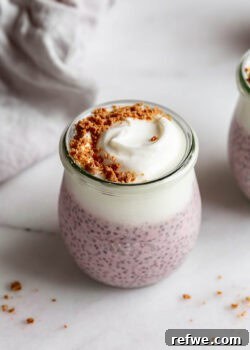 Protein chia pudding in a cup topped with graham cracker crumbs.