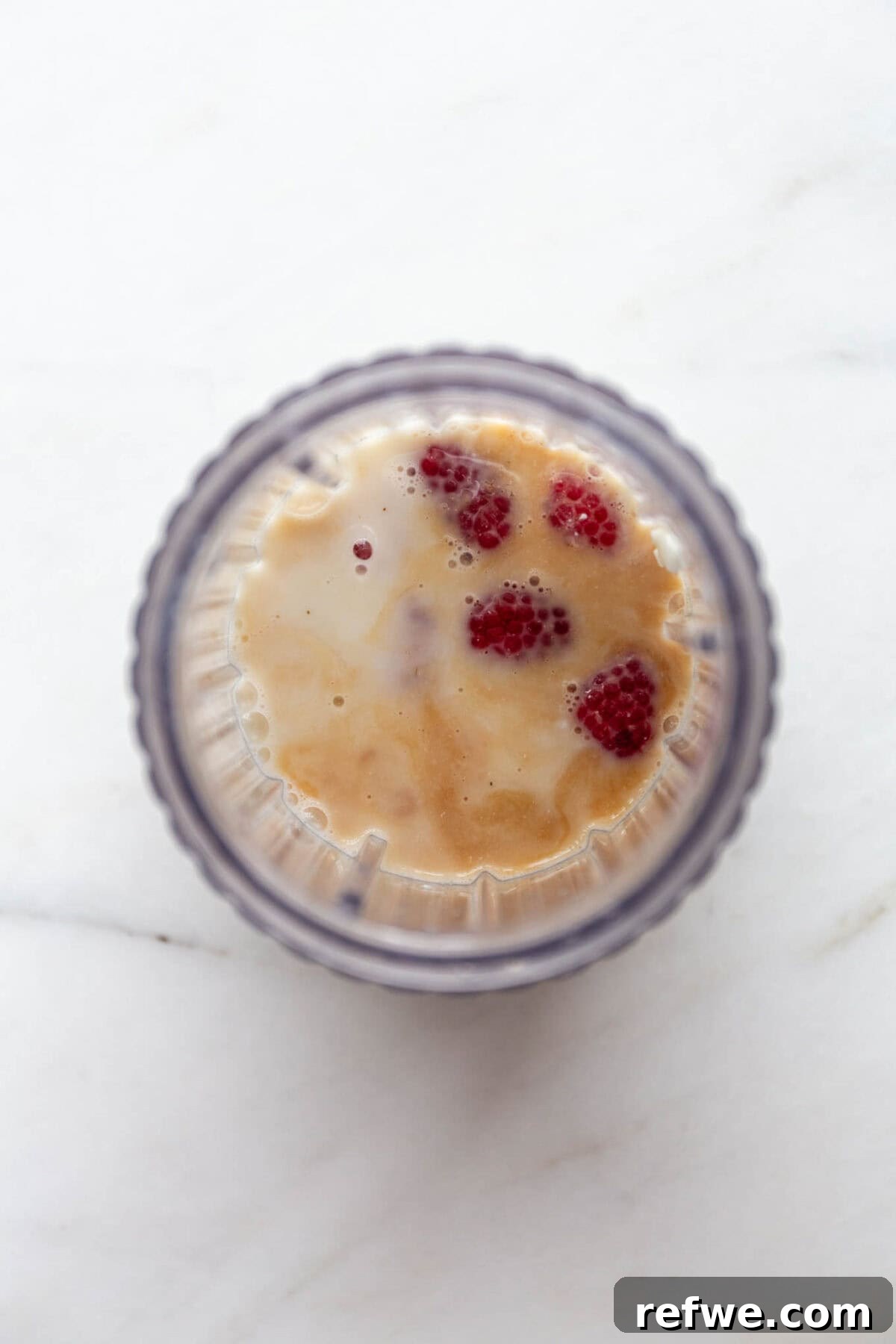 Supercharged Protein Chia Pudding 4 cottage cheese, raspberries, maple syrup and vanilla in a blender container.