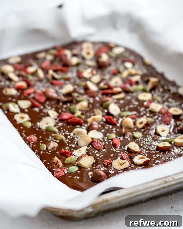 Glow-Boosting Chocolate Bark 3 Close-up of Superfood Chocolate Bark on a white plate