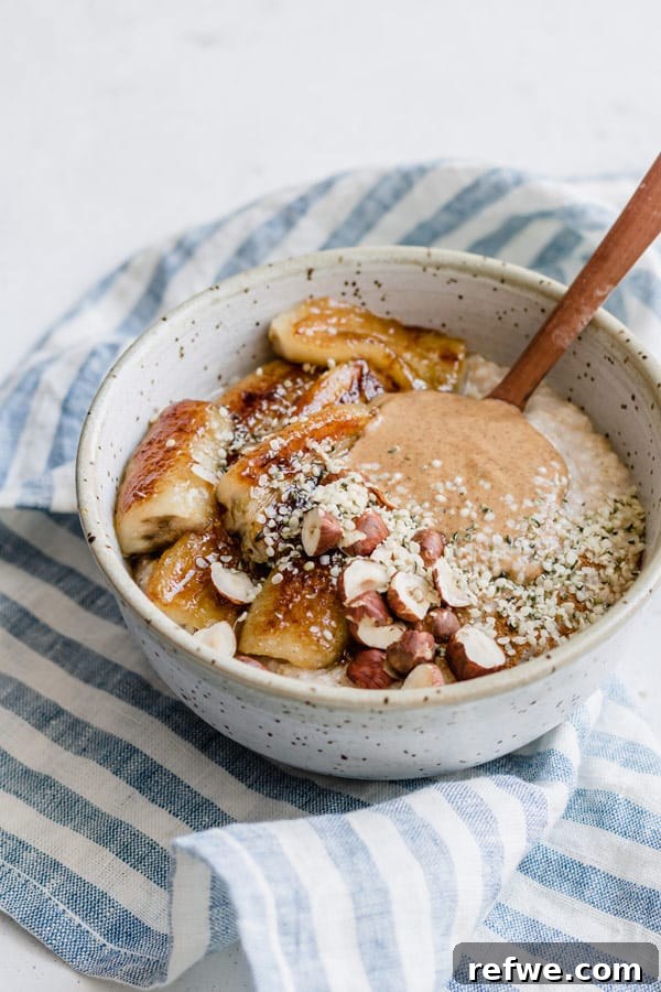 Steel Cut Oats with Caramelized Maple Bananas 3 Close-up of steel cut oats with maple fried bananas, showing the creamy texture and sweet toppings