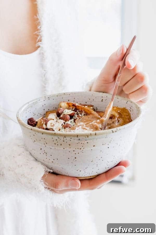 Steel Cut Oats with Caramelized Maple Bananas 5 Side view of steel cut oats with various toppings, emphasizing fresh and wholesome ingredients
