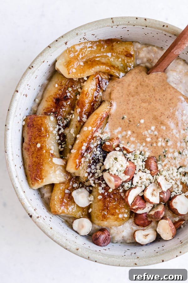 Steel Cut Oats with Caramelized Maple Bananas 6 A bowl of steel cut oats with maple fried bananas and additional healthy toppings