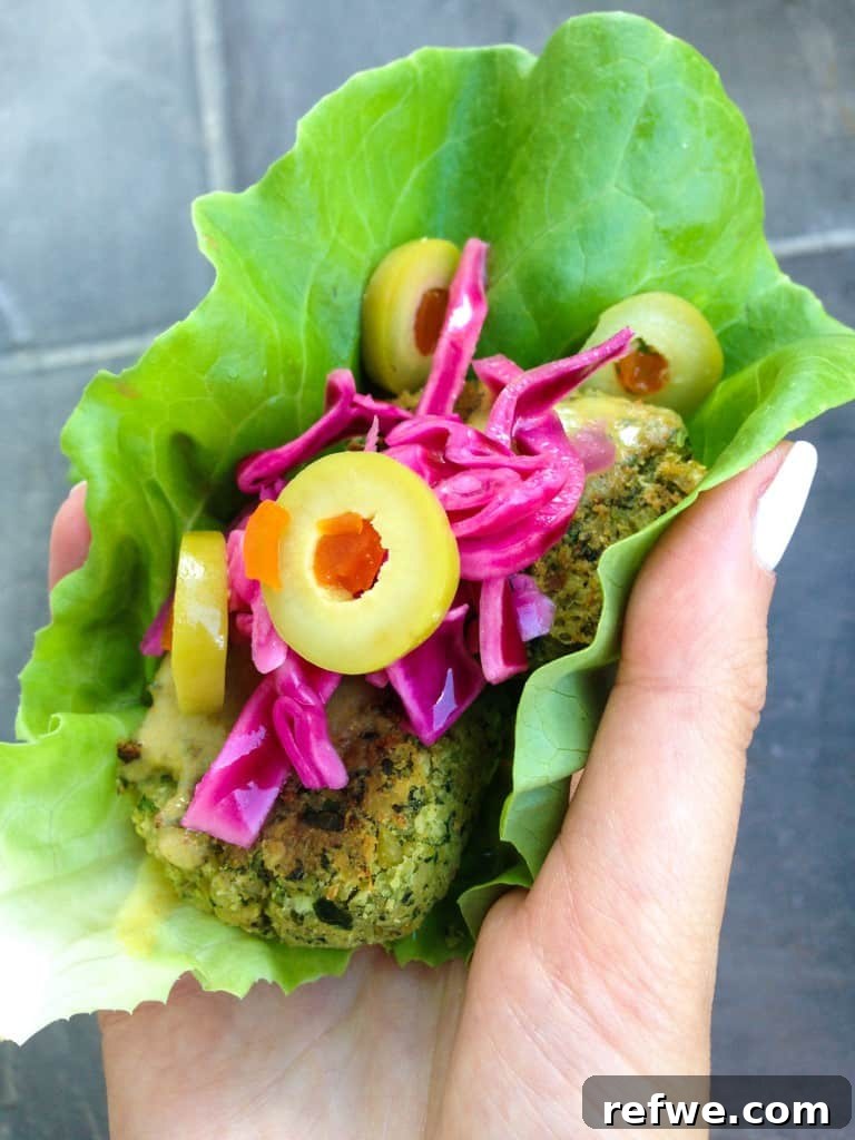 Crispy Baked Falafel with Golden Turmeric Tahini Drizzle 4 Baked Falafel in a Fresh Lettuce Wrap