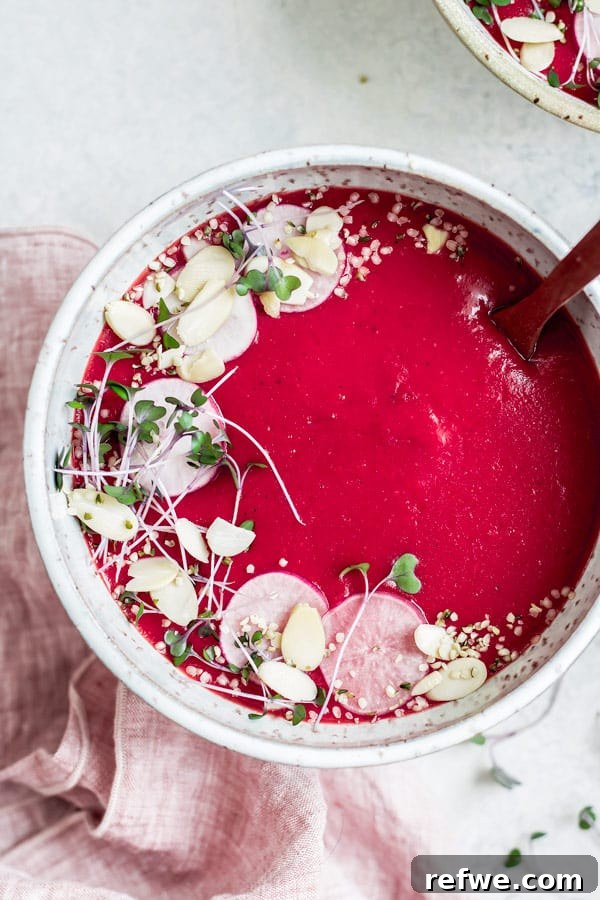 Hearty Vegan Beet Potato Leek Soup 3 Close-up of creamy vegan beet, potato, and leek soup, showcasing its beautiful red color and smooth texture.
