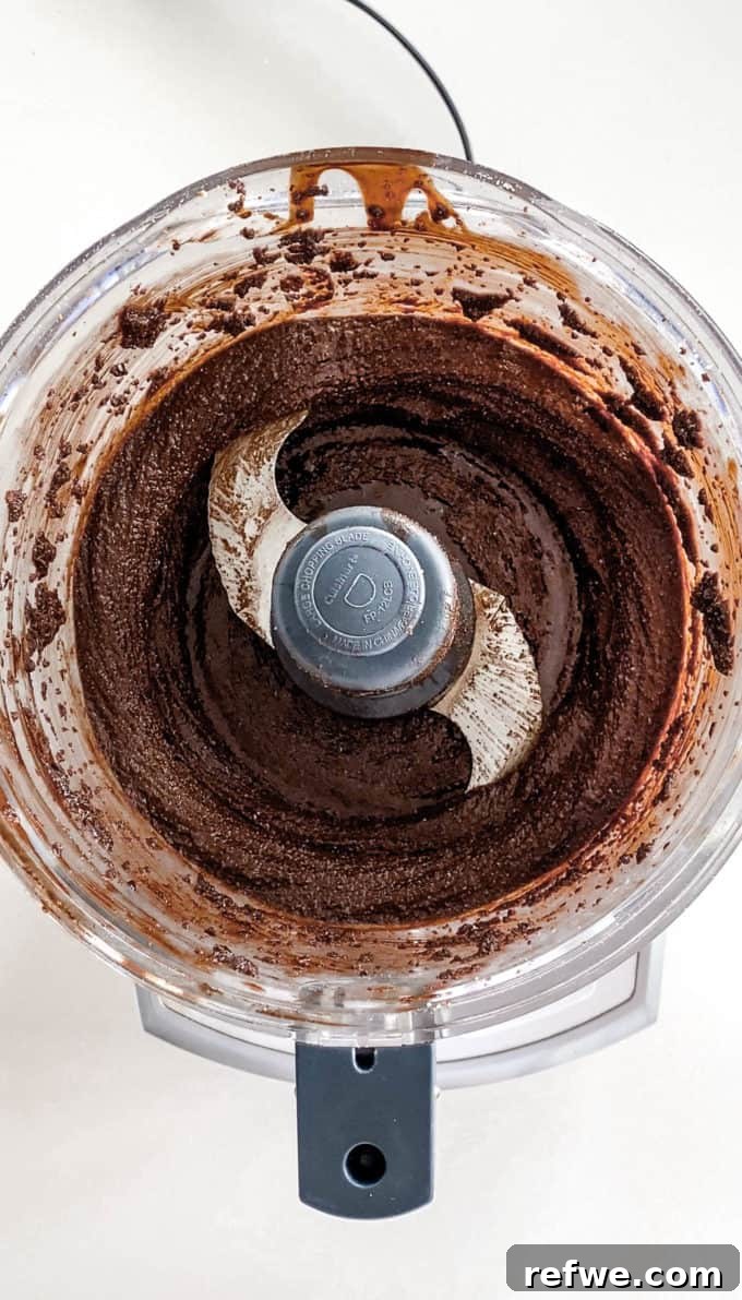 Plant-Based Hazelnut Cacao Dream 12 Smooth and creamy vegan Nutella blending in a food processor.