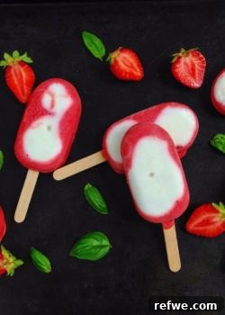 Creamy Strawberry Basil Popsicles in molds