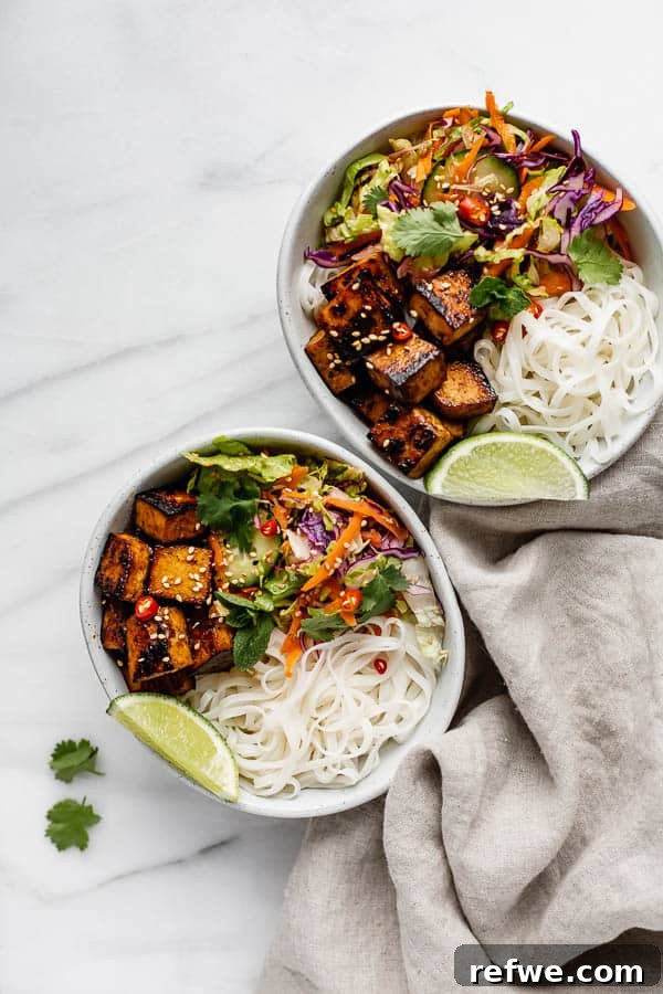 Your First Perfect Plate: Food Photography Basics 11 Two bowls filled with Vietnamese salad, rice noodles, and lemongrass tofu, presented with a vibrant and fresh aesthetic.