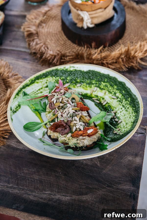Artisanal vegan toast with sunflower seed ricotta and fresh herbs at Moro