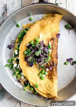Chickpea omelette with spinach and spring peas