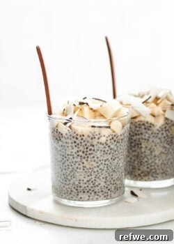 Two beautiful cups of banana chia pudding, ready to be enjoyed.