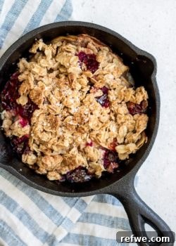 Healthy Apple Raspberry Coconut Crisp with a golden, crunchy topping