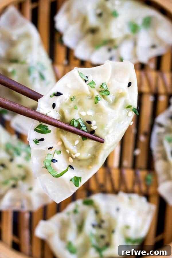 Close-up of freshly steamed Edamame and truffle dumplings, showcasing their delicate texture and inviting green filling.