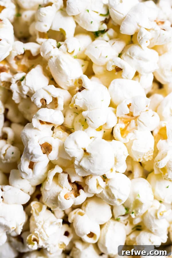 Salted Margarita Popcorn Perfection 5 Salted margarita popcorn - popcorn kernels popping in a pot on the stovetop