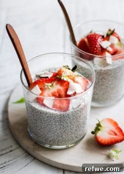 A beautifully presented coconut chia pudding, ready to be served, topped with fresh fruit.