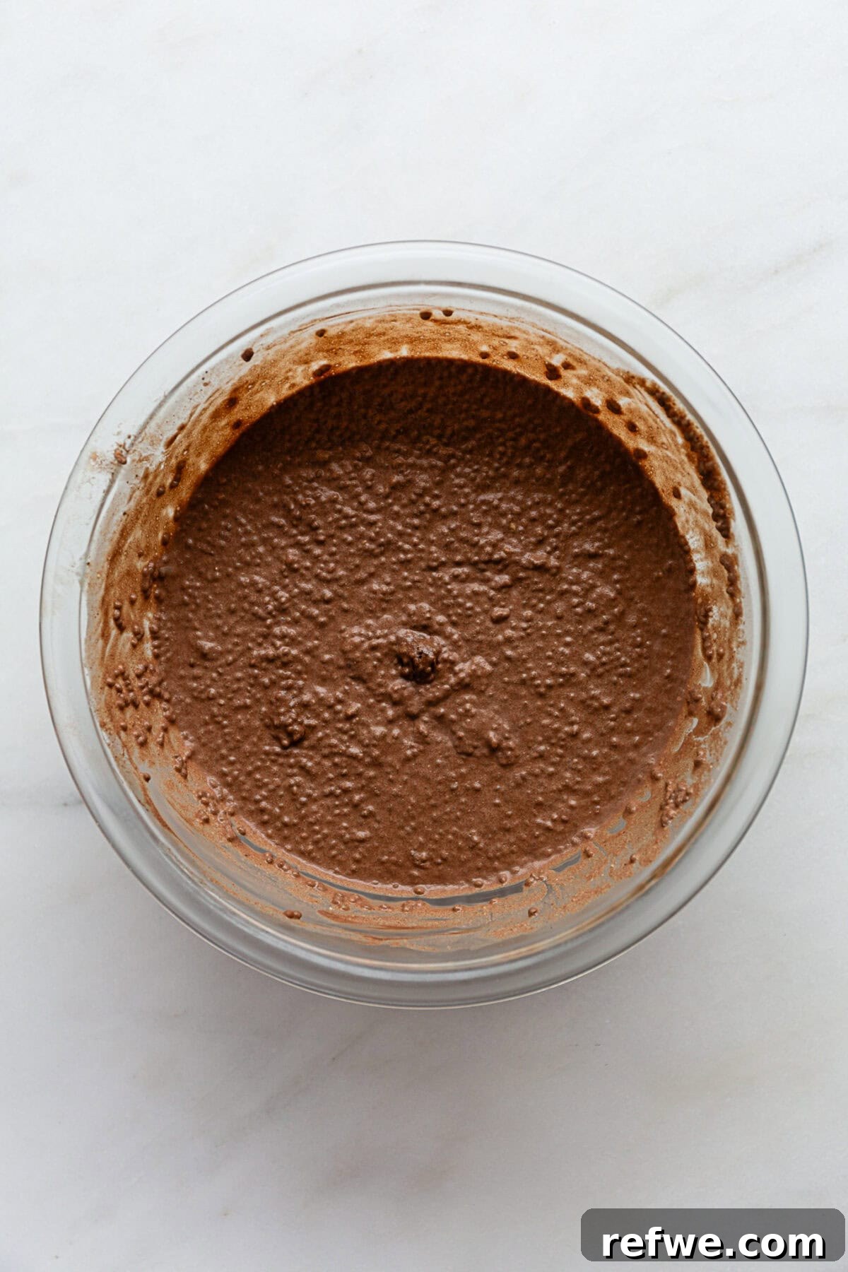 Decadent Chocolate Chia Pudding 7 A bowl of Snickers-inspired chia pudding, already set and ready for toppings, illustrating the final, chilled consistency of the pudding.