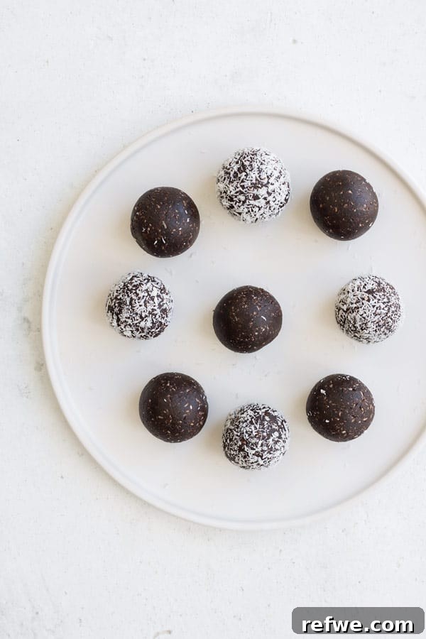 Chocolate Macaroon Power Bites 3 Close-up of chocolate macaroon energy balls, showing the shredded coconut texture on the outside.