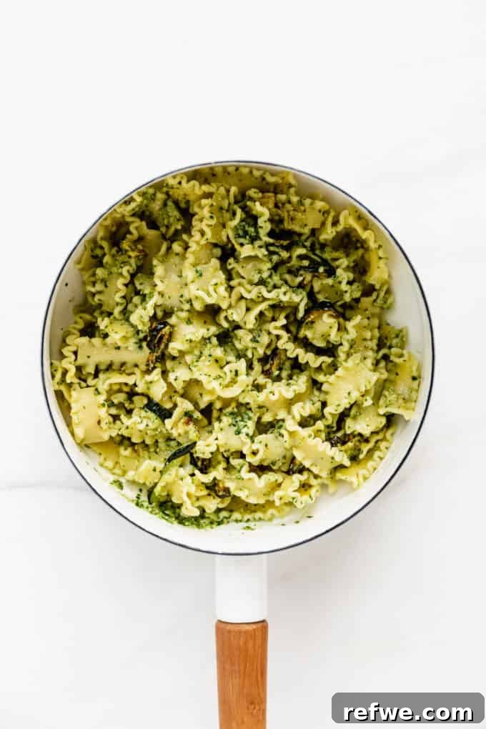 Zesty Pesto Veggie Medley 6 Vibrant pesto pasta with roasted zucchini, gently tossed together in a white pot