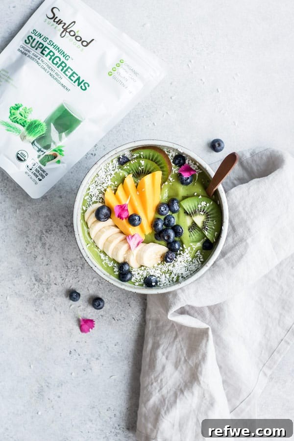Power-Packed Green Smoothie Bowl 3 Close-up of a Superfood Green Smoothie Bowl with colorful fruit toppings