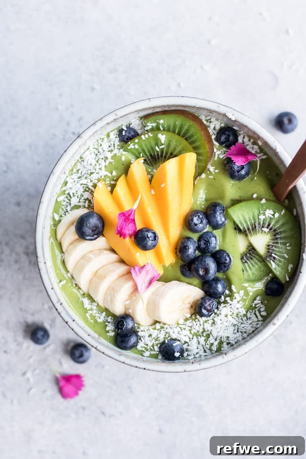 Power-Packed Green Smoothie Bowl 4 Overhead view of a Superfood Green Smoothie Bowl with diverse fresh toppings