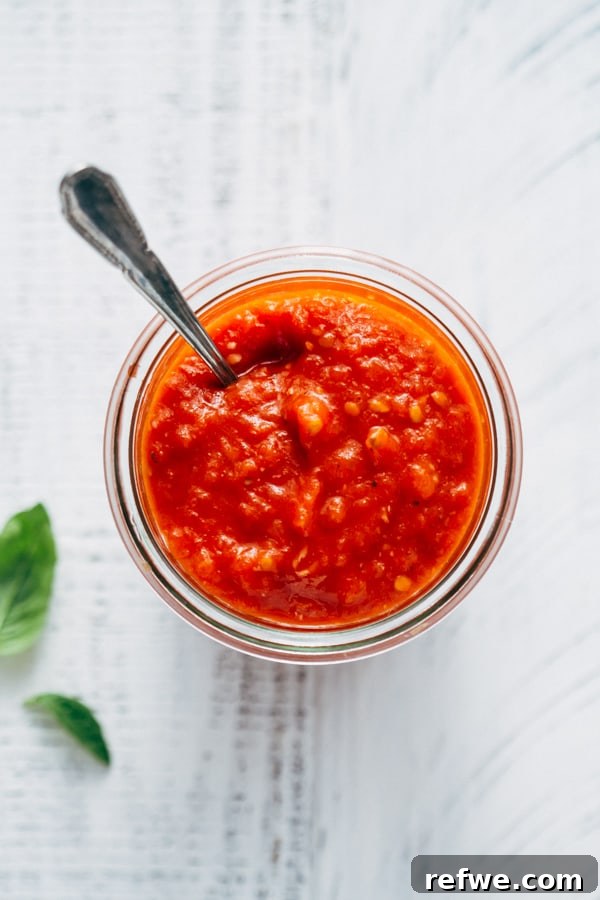 close-up of spaghetti coated in homemade tomato sauce