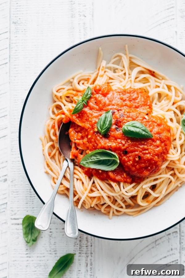 homemade tomato sauce simmering gently in a pot