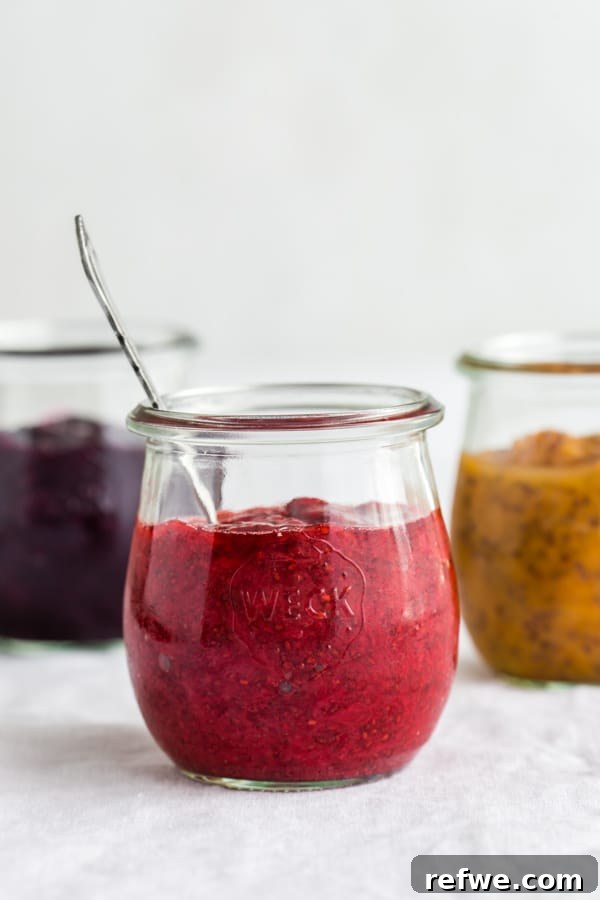 Simple Chia Seed Jam: Three Flavorful Variations 2 Three jars of chia seed jam: strawberry, blueberry, and peach.
