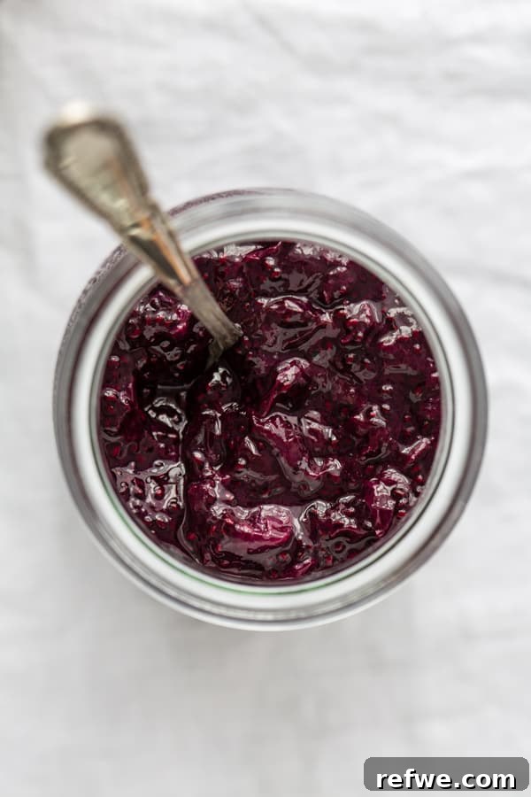 Simple Chia Seed Jam: Three Flavorful Variations 4 Close-up of strawberry chia seed jam in a jar.