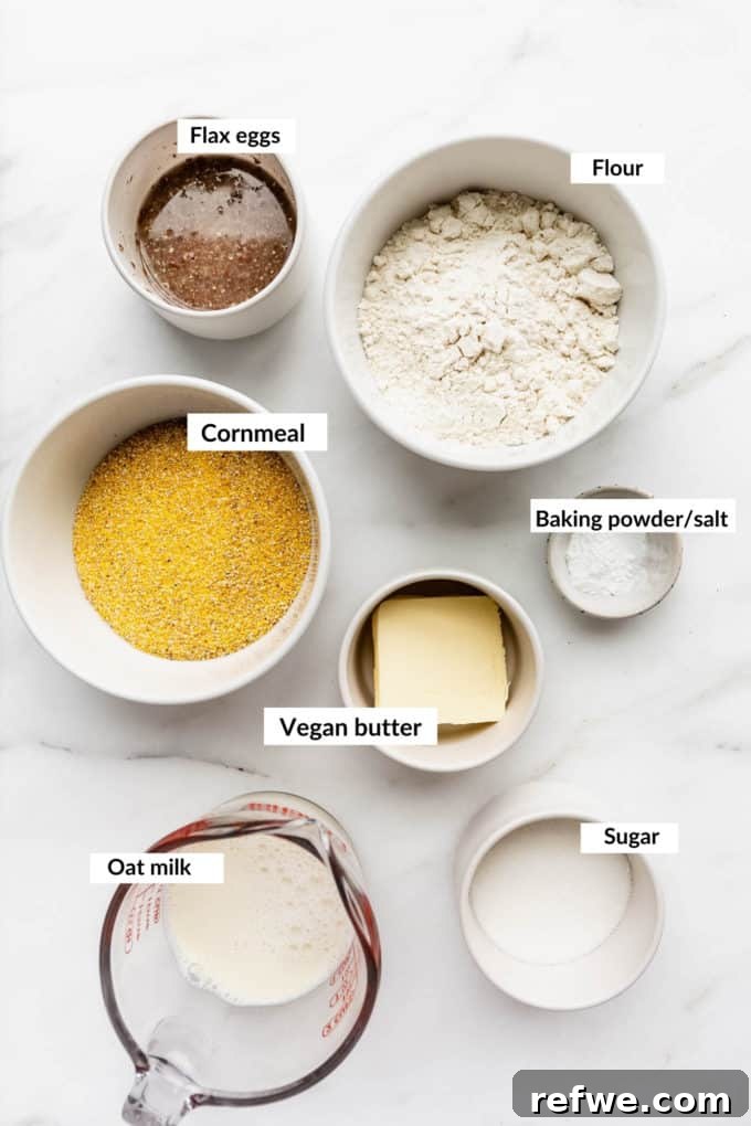 Plant-Based Cornbread 3 A beautifully arranged flat lay of all the vegan cornbread ingredients, including flours, cornmeal, sweeteners, and liquids, ready for mixing.