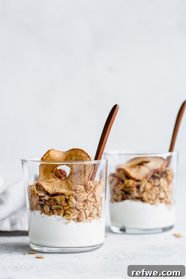 Apple Crumble Granola 4 Two cups filled with creamy yogurt and generously topped with homemade apple pie granola.