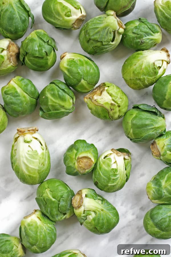 Unlock the Flavor: Brussels Sprouts You'll Love 2 Crispy and delicious roasted Brussels sprouts on a baking sheet
