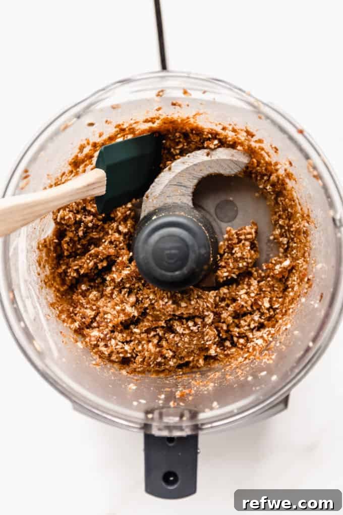 Dairy-Free Blueberry Bliss 4 A food processor with blended date, walnuts and oats in it