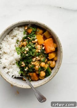 A bowl of pumpkin chickpea curry and rice, perfect for a cozy meal.