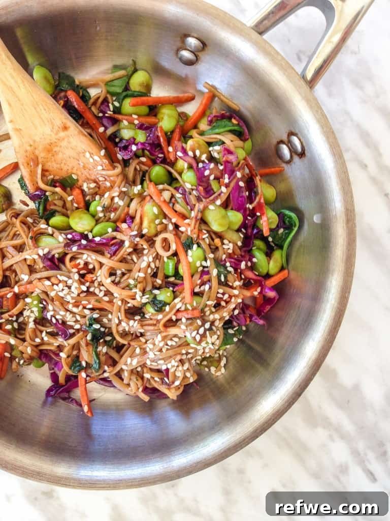 Sweet Maple Umami Soba Stir-fry 2 Close-up of a steaming bowl of Honey Soy Soba Noodle Stir-Fry, ready to eat