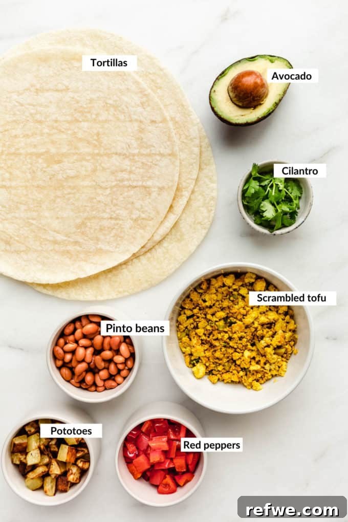 Plant-Powered Breakfast Wrap 3 A flat lay photograph of all the fresh and colorful ingredients needed for vegan breakfast burritos