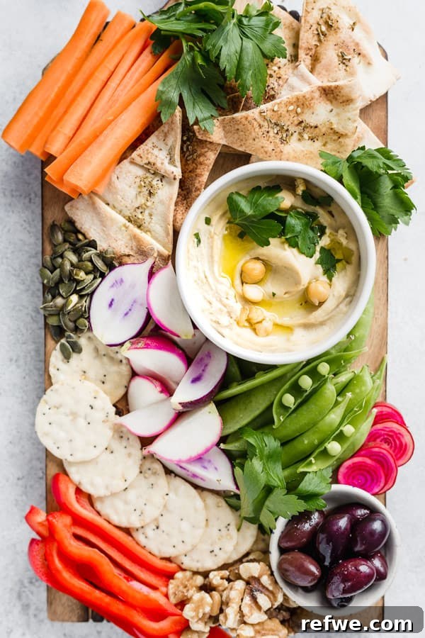 Wholesome Homemade Hummus 6 A vibrant bowl of healthy hummus with various toppings and ingredients