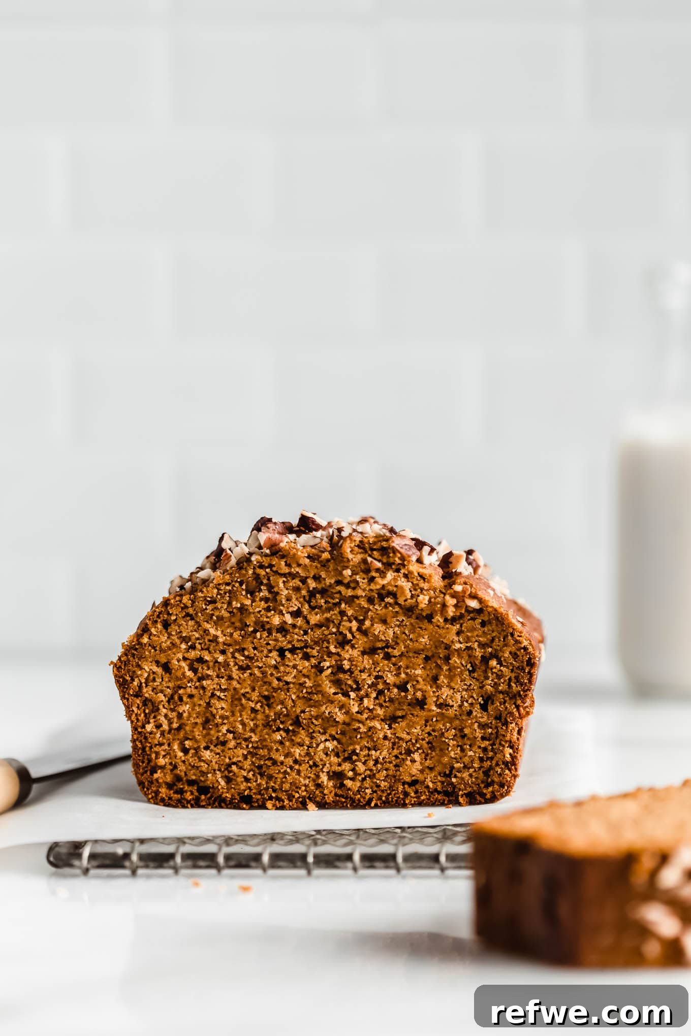Wholesome Spiced Pumpkin Bread 2 A beautifully baked healthy pumpkin bread on a cooling rack, ready to be sliced.