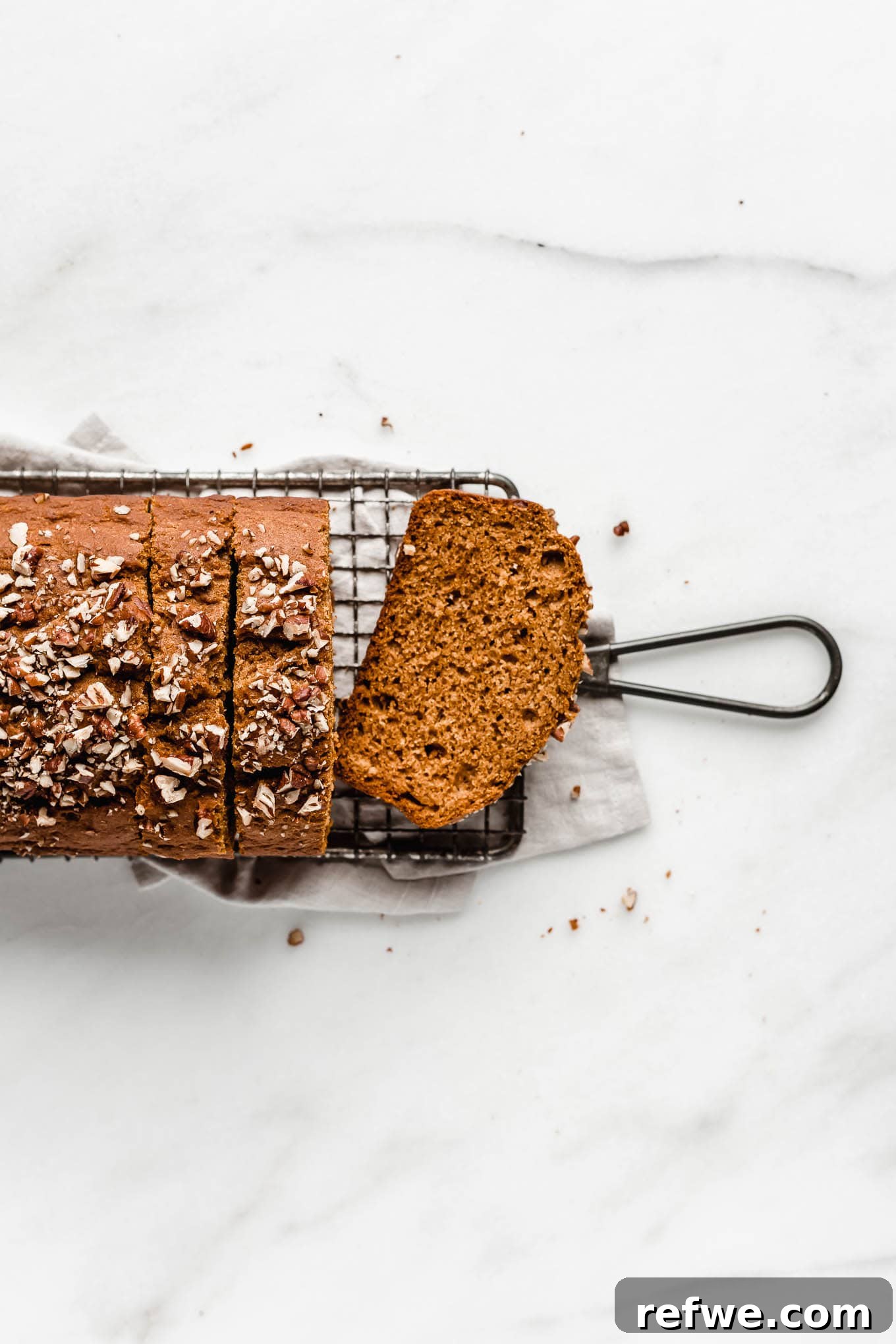 Wholesome Spiced Pumpkin Bread 8 A freshly baked healthy maple pecan bread, cooling on a rack, showing its perfect golden crust.