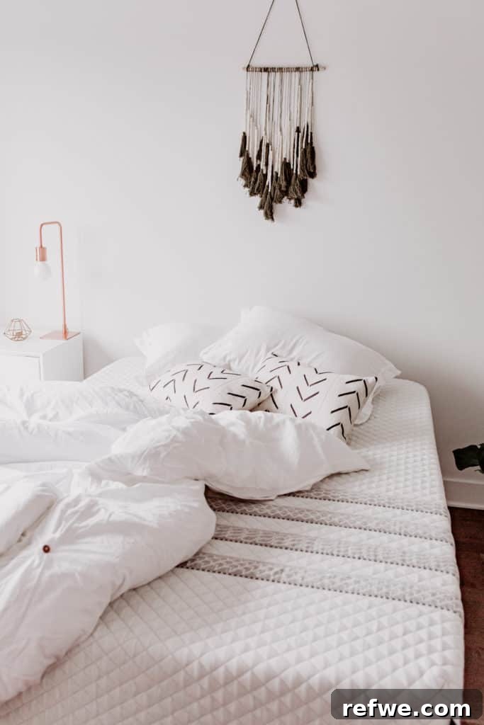 Indulgent Mornings Breakfast in Bed Secrets 3 A beautifully set breakfast in bed with tea, a pastry, and fresh flowers, emphasizing comfort and aesthetics.